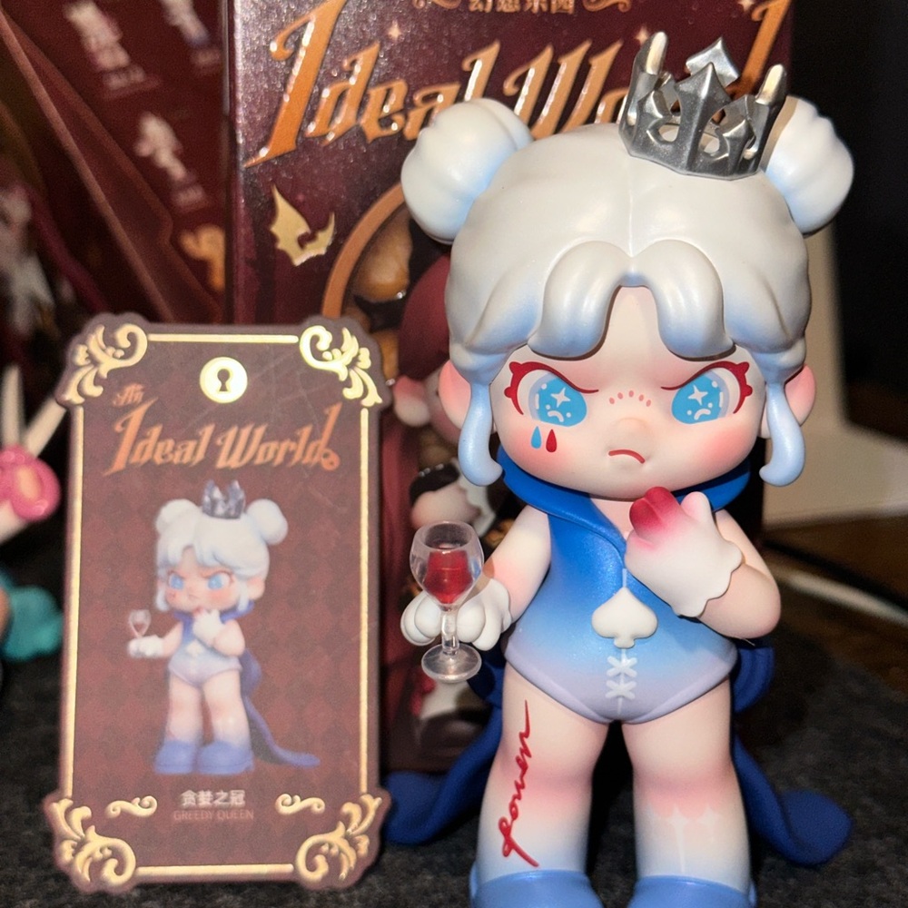 Blue and White Figurine with Crown